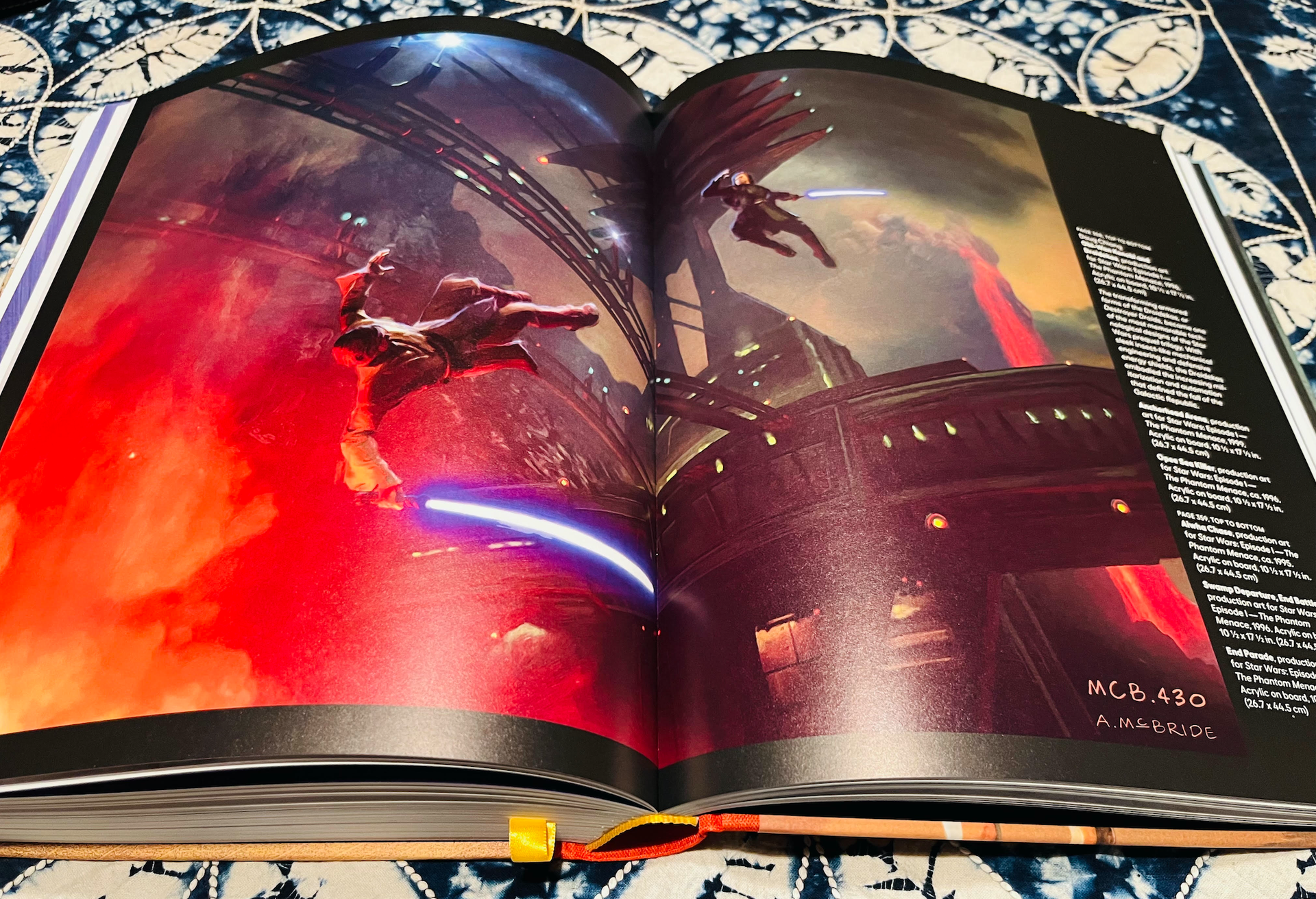an open book with sci-fi art on the pages