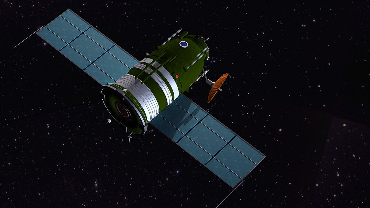 a stubby soyuz-looking green spacecraft with solar panels