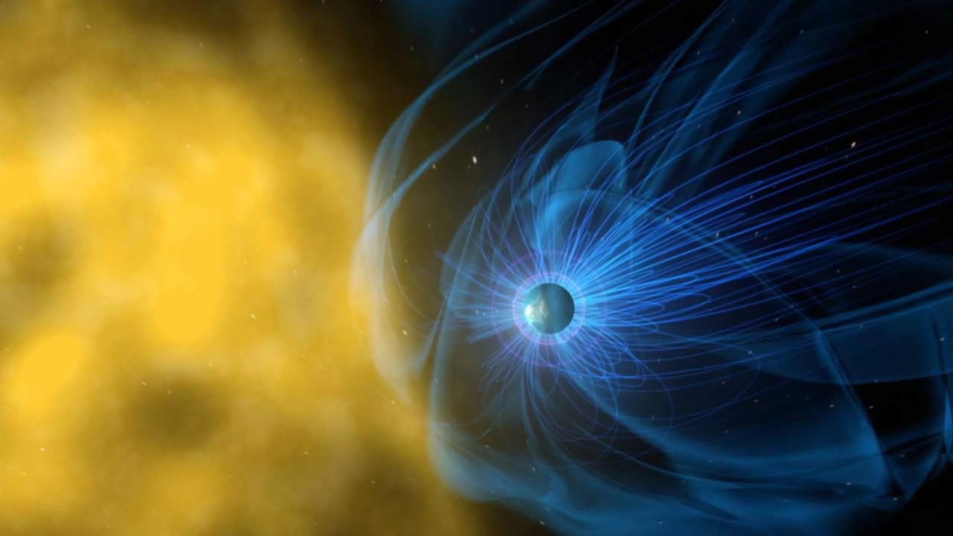 yellow gases swirl near a blue orb surrounded by a blue, wispy cloud