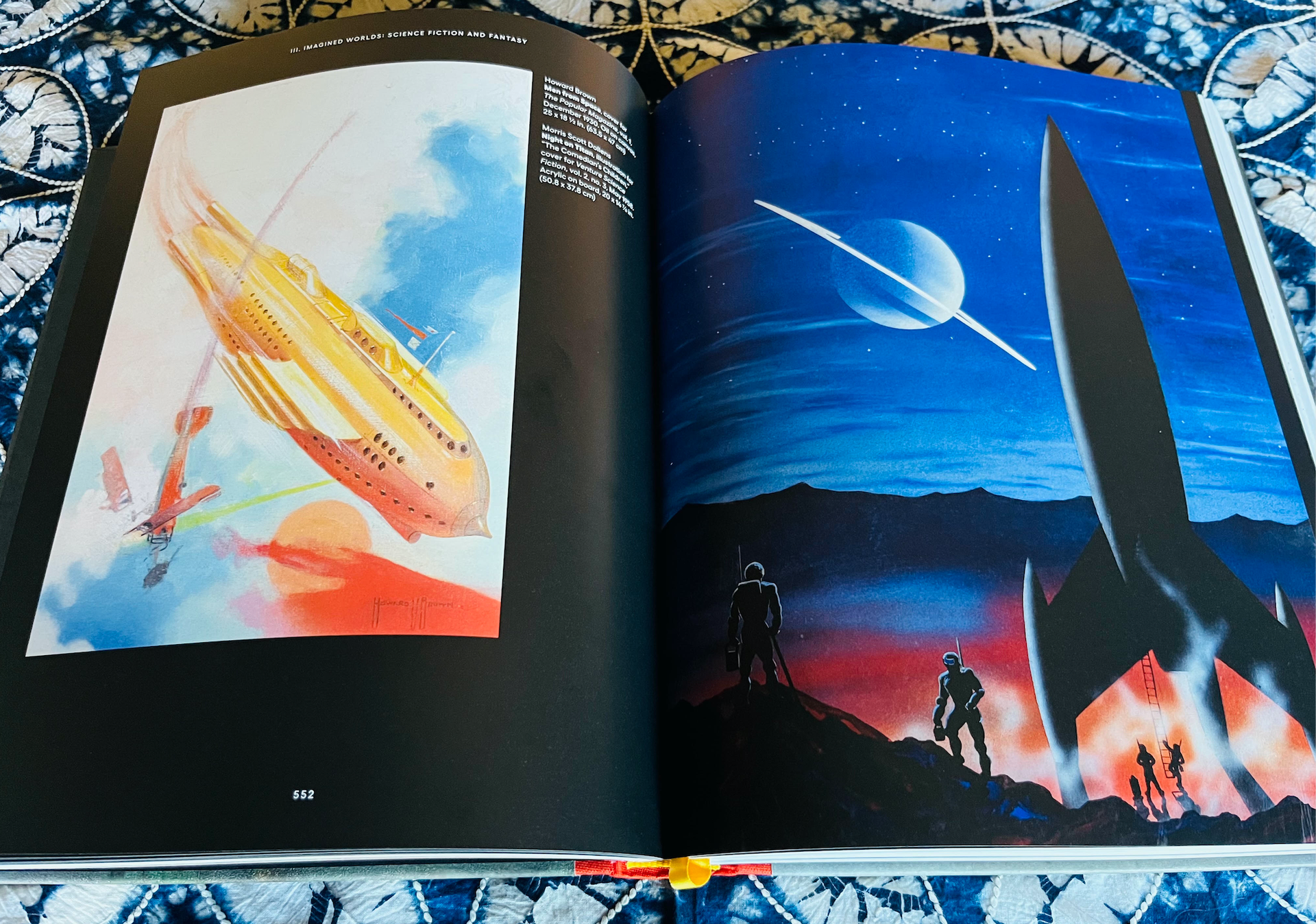 an open book with pages of sci-fi art